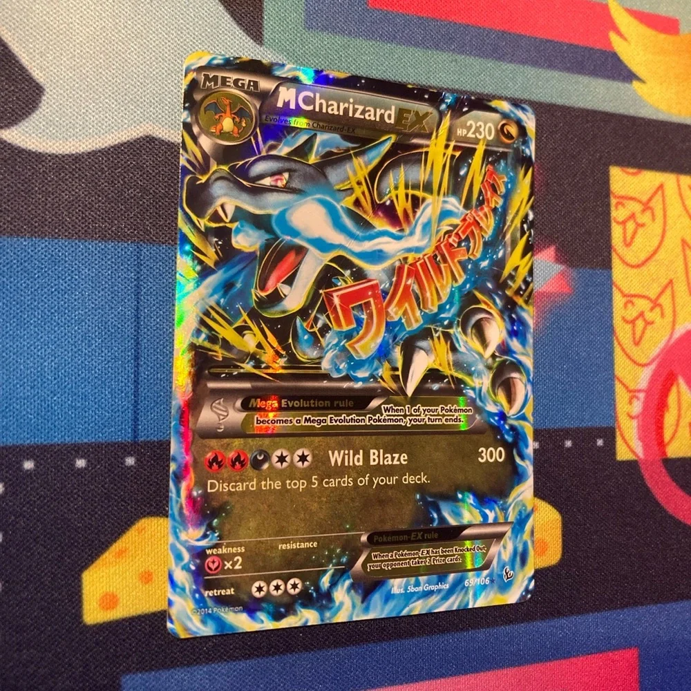 2014 charizard ex pokemon card value CGC 6.5 EX/NM+ M Charizard EX 69/106